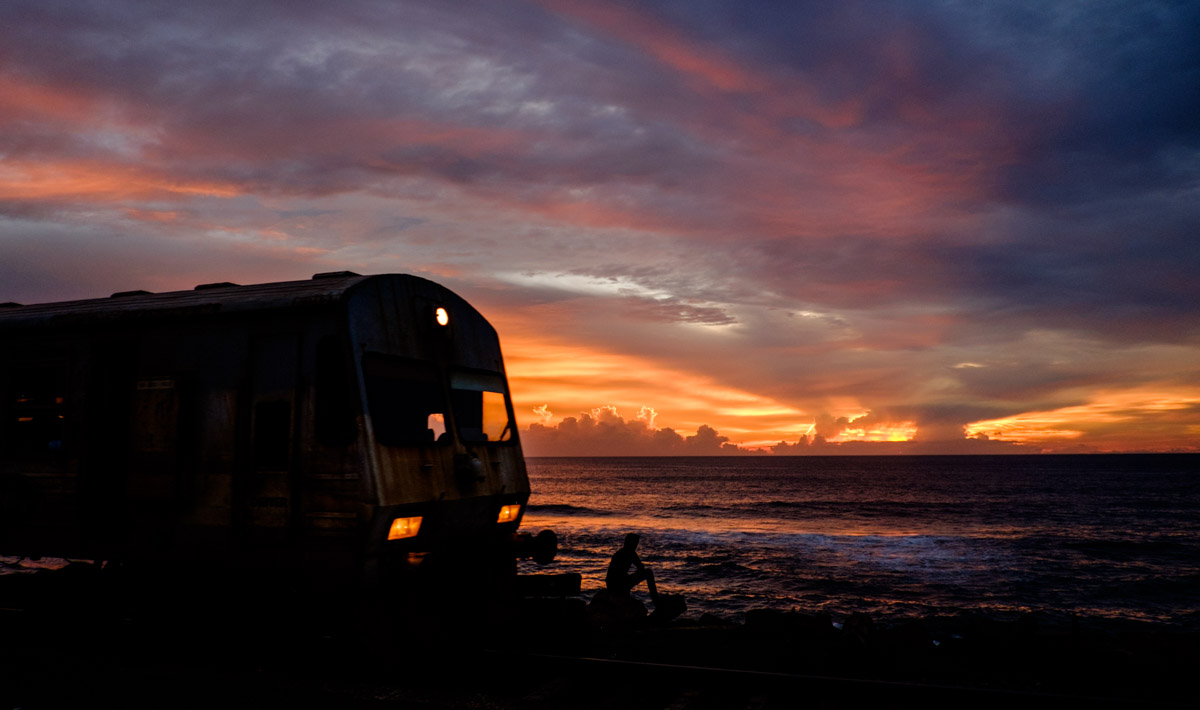 One of the best sunsets we saw, completely with moving train and a lone person staring at the sun, award winner!