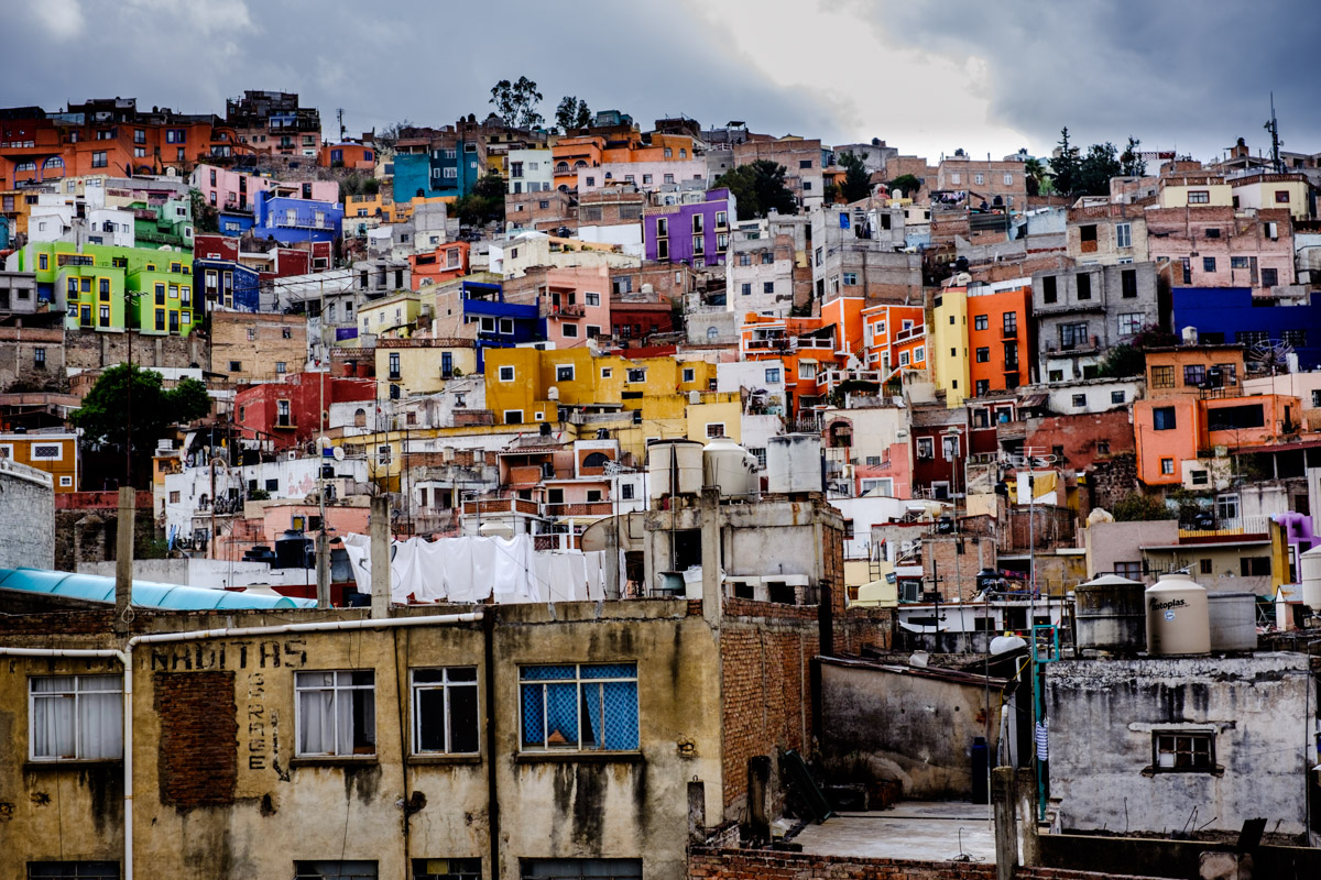 Steep hills and colourful houses of Guanajuato, captured by me standing on my toes, reaching over a tall wall to get this view!